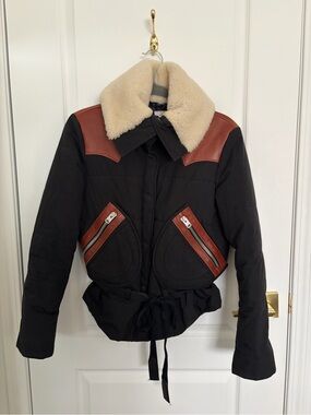 Coach’s Women’s Black Jacket with Tan Shearling Collar